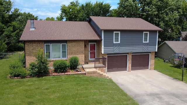 2109 Bridgewater Dr, Columbia, MO 65202 - split level home featuring brick siding, a garage, driveway, and a shingled roof