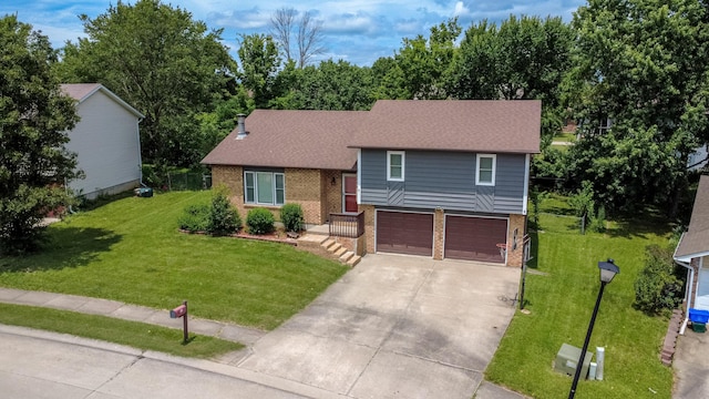 2109 Bridgewater Dr, Columbia, MO 65202 - tri-level home with brick siding, concrete driveway, an attached garage, and a front lawn