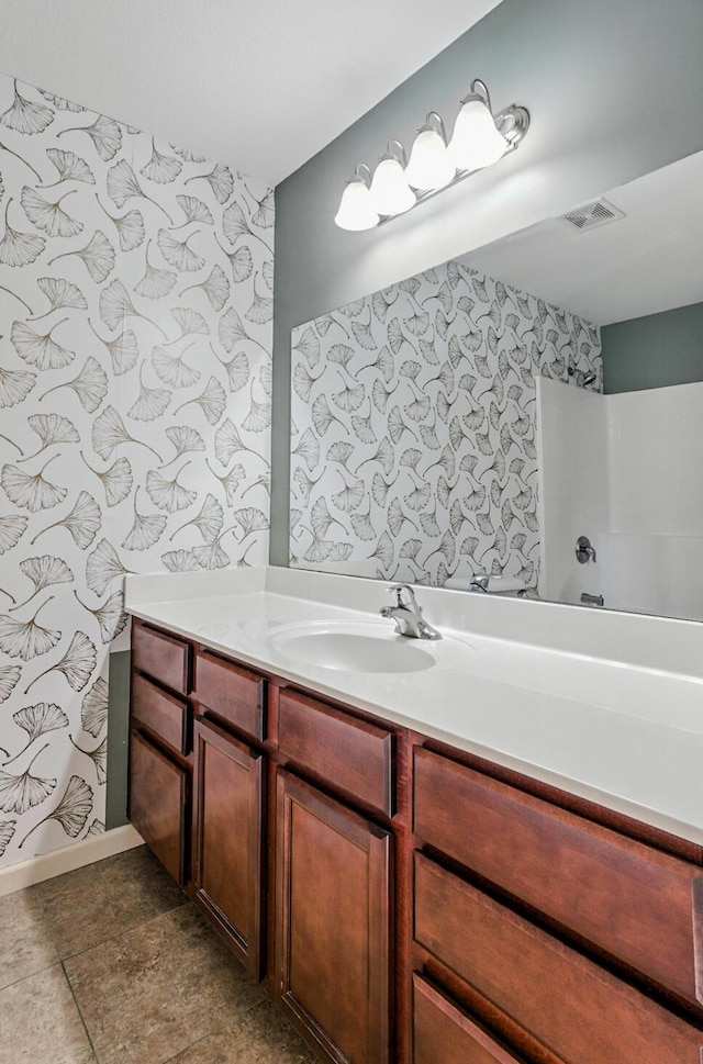 3904 Clydesdale Dr, Columbia, MO 65202 - full bath with wallpapered walls, vanity, and a bath