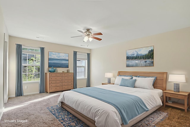 3904 Clydesdale Dr, Columbia, MO 65202 - carpeted bedroom with baseboards and ceiling fan