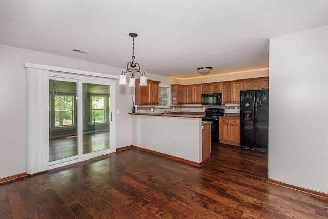 9855 N Route E, Harrisburg, MO 65256 - kitchen featuring black appliances, brown cabinetry, a peninsula, and dark wood finished floors