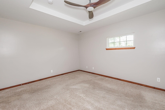 9855 N Route E, Harrisburg, MO 65256 - empty room with carpet floors, a raised ceiling, a ceiling fan, and a smoke detector