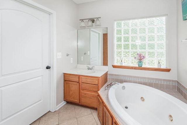 9855 N Route E, Harrisburg, MO 65256 - bathroom featuring vanity, a jetted tub, healthy amount of natural light, and tile patterned floors