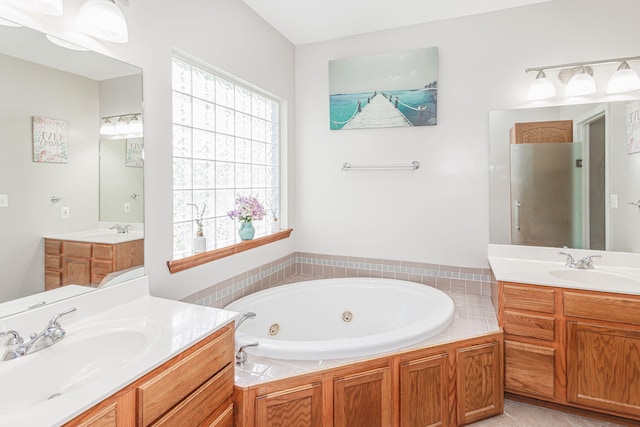 9855 N Route E, Harrisburg, MO 65256 - bathroom featuring two vanities, a jetted tub, and a stall shower
