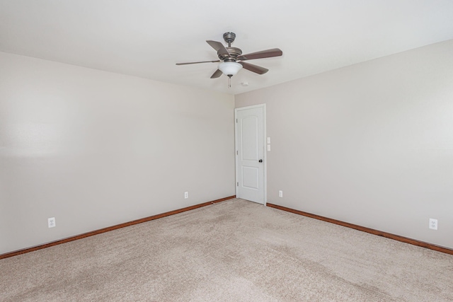 9855 N Route E, Harrisburg, MO 65256 - unfurnished room featuring light colored carpet and a ceiling fan