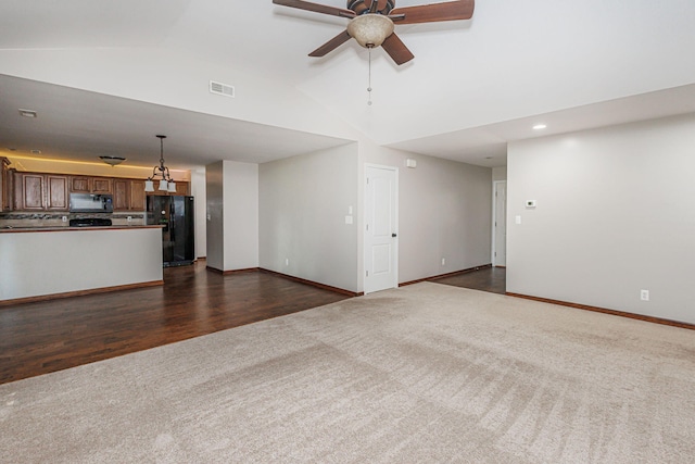 9855 N Route E, Harrisburg, MO 65256 - unfurnished living room featuring dark colored carpet, ceiling fan, high vaulted ceiling, recessed lighting, and dark wood-style floors