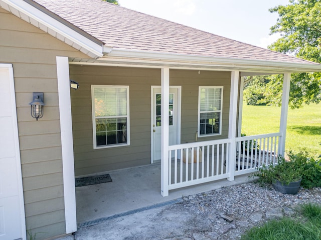 9855 N Route E, Harrisburg, MO 65256 - entrance to property with a shingled roof, covered porch, and a yard