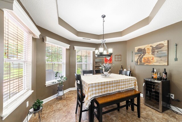 605 Teakwood Ct, Ashland, MO 65010 - dining space featuring a raised ceiling and a chandelier
