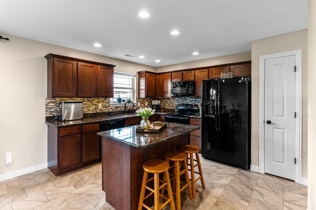 6655 American Setter Dr, Ashland, MO 65010 - kitchen featuring black appliances, backsplash, a breakfast bar, a kitchen island, and recessed lighting