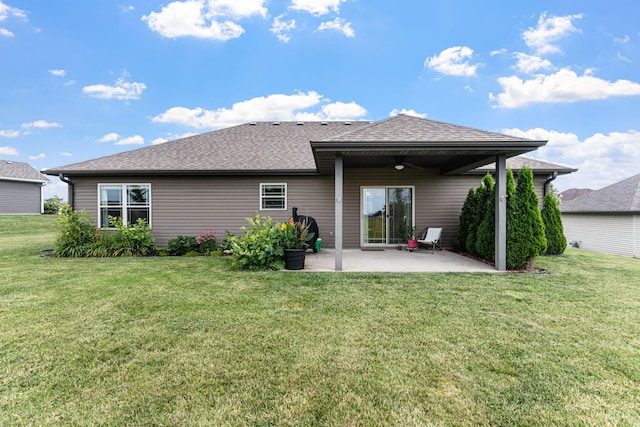 6655 American Setter Dr, Ashland, MO 65010 - back of property featuring a patio area, a ceiling fan, a yard, and a shingled roof