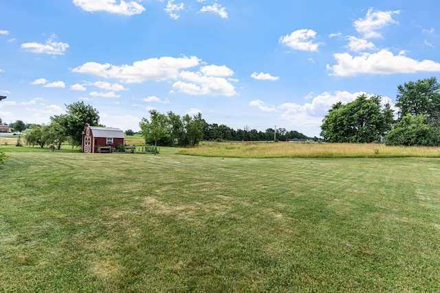 6655 American Setter Dr, Ashland, MO 65010 - view of green lawn with a rural view and a storage unit