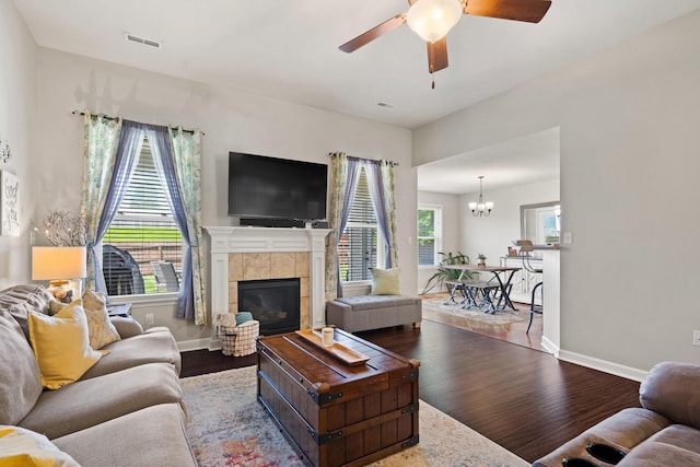 6003 Misty Springs Way, Columbia, MO 65202 - living area featuring wood finished floors, ceiling fan, a fireplace, and a chandelier