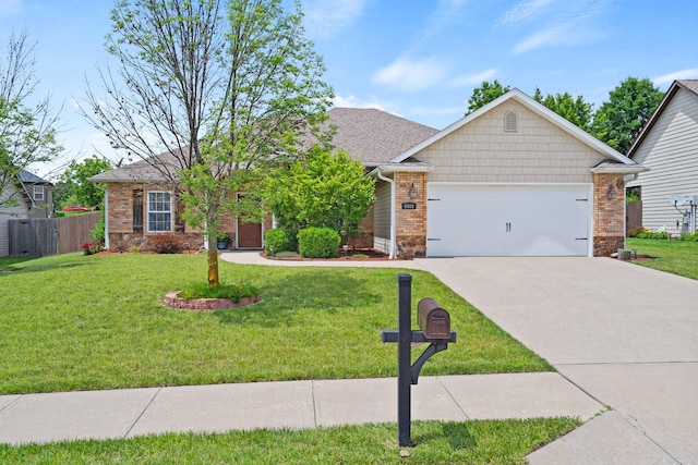 6003 Misty Springs Way, Columbia, MO 65202 - view of front of home with a garage, driveway, and brick siding