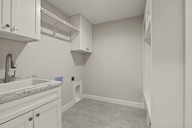 924 Engle Dr, Columbia, MO 65203 - washroom with electric dryer hookup, cabinet space, and washer hookup