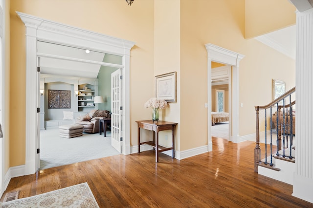 4902 Cochero Ct, Columbia, MO 65203 - entrance foyer featuring wood finished floors, stairway, french doors, and ornamental molding