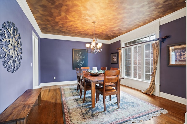 4902 Cochero Ct, Columbia, MO 65203 - dining room featuring a chandelier, wood finished floors, and crown molding