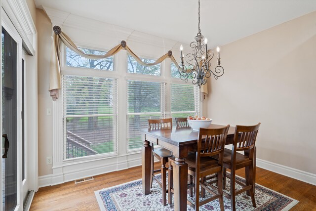 4902 Cochero Ct, Columbia, MO 65203 - dining space featuring a chandelier and wood finished floors