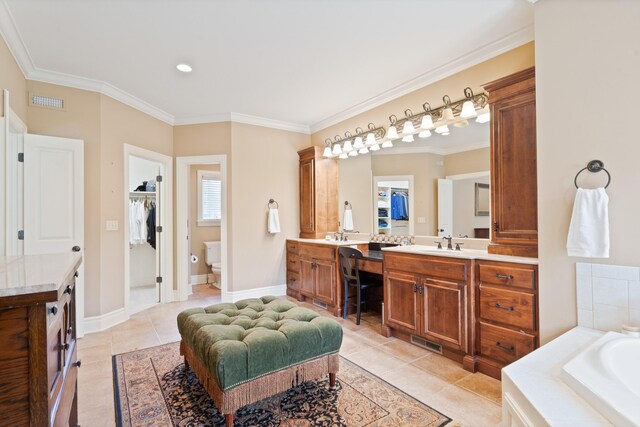 4902 Cochero Ct, Columbia, MO 65203 - bathroom featuring tile patterned flooring, vanity, a bath, ornamental molding, and a spacious closet