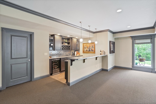4902 Cochero Ct, Columbia, MO 65203 - kitchen with beverage cooler, a breakfast bar area, light carpet, crown molding, and open shelves