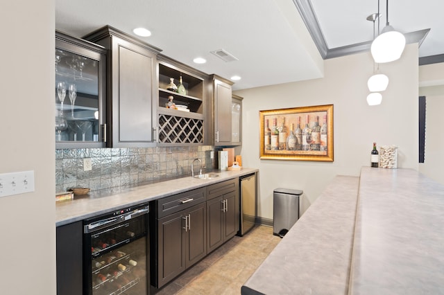 4902 Cochero Ct, Columbia, MO 65203 - indoor wet bar with beverage cooler, backsplash, pendant lighting, recessed lighting, and light tile patterned floors