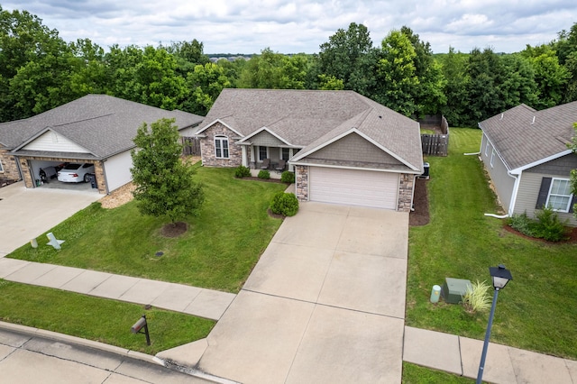 3509 Tuscany, Columbia, MO 65202 - view of front of home with stone siding, concrete driveway, a garage, and a shingled roof