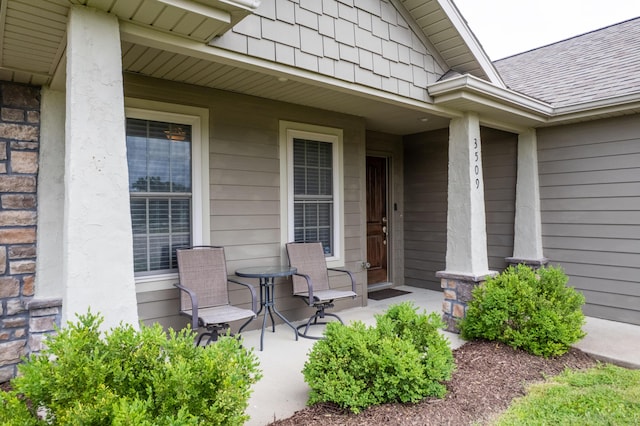 3509 Tuscany, Columbia, MO 65202 - doorway to property featuring a porch and roof with shingles