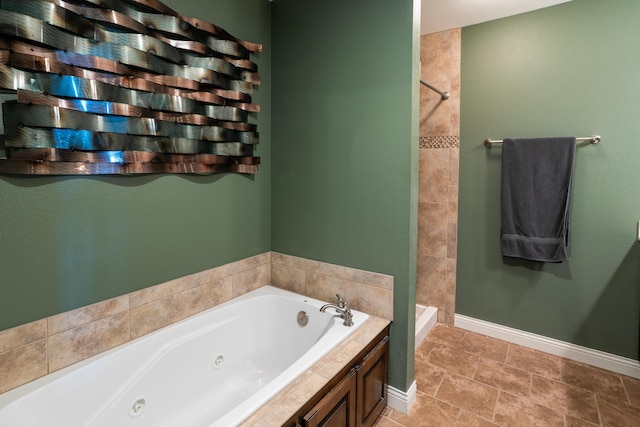 3509 Tuscany, Columbia, MO 65202 - bathroom featuring a tub with jets and tiled shower