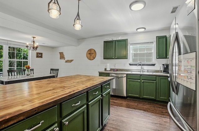 5 Amazon Dr, Columbia, MO 65202 - kitchen featuring green cabinetry, appliances with stainless steel finishes, butcher block counters, and hanging light fixtures