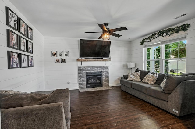 5 Amazon Dr, Columbia, MO 65202 - living room featuring wood-type flooring, a ceiling fan, wooden walls, and a fireplace