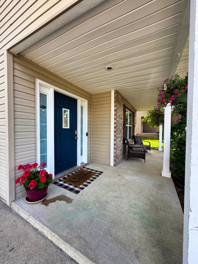 5 Amazon Dr, Columbia, MO 65202 - view of exterior entry with covered porch and brick siding