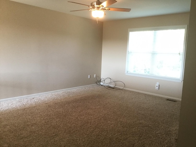201 Port Way, Columbia, MO 65201 - spare room with a ceiling fan and carpet flooring