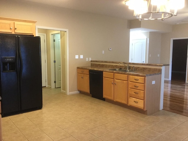 201 Port Way, Columbia, MO 65201 - kitchen featuring black appliances, a peninsula, light tile patterned floors, a chandelier, and hanging light fixtures