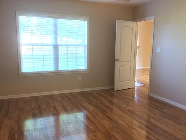 201 Port Way, Columbia, MO 65201 - empty room with wood finished floors and baseboards