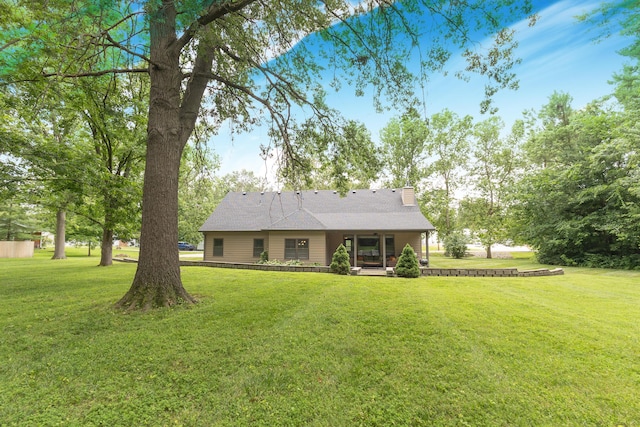 315 W Proctor St, Sturgeon, MO 65284 - view of front of home featuring a front yard, a chimney, and a porch