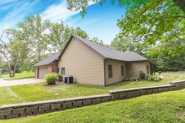 315 W Proctor St, Sturgeon, MO 65284 - view of property exterior featuring driveway, an attached garage, a lawn, and roof with shingles