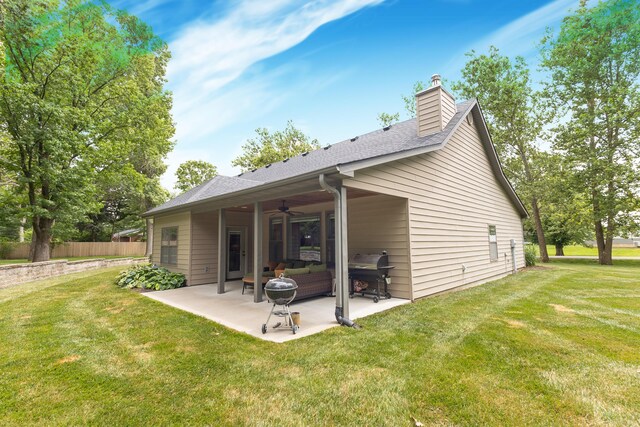 315 W Proctor St, Sturgeon, MO 65284 - back of property with ceiling fan, a patio area, a chimney, an outdoor living space, and roof with shingles