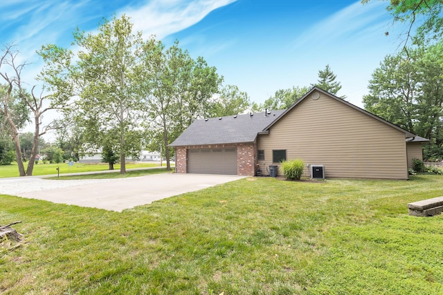 315 W Proctor St, Sturgeon, MO 65284 - view of home's exterior with brick siding, driveway, a garage, and a lawn