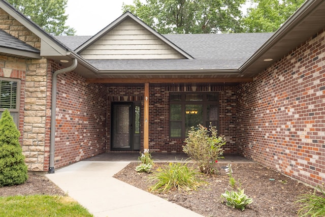 315 W Proctor St, Sturgeon, MO 65284 - doorway to property featuring roof with shingles and brick siding