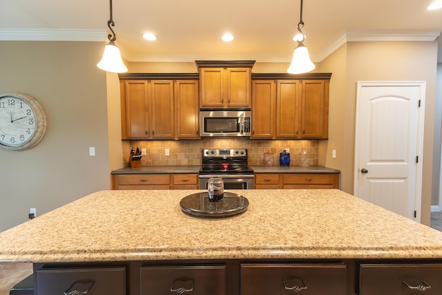 315 W Proctor St, Sturgeon, MO 65284 - kitchen featuring stainless steel appliances, a kitchen island, decorative backsplash, crown molding, and pendant lighting
