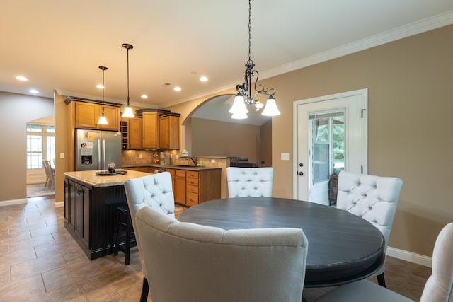 315 W Proctor St, Sturgeon, MO 65284 - dining room with ornamental molding, recessed lighting, and arched walkways