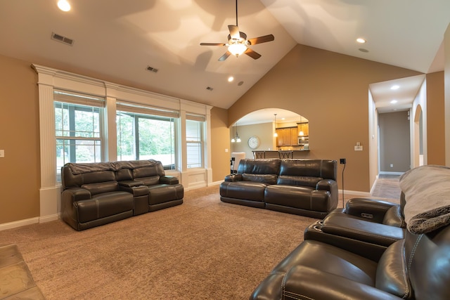315 W Proctor St, Sturgeon, MO 65284 - living area with arched walkways, a ceiling fan, high vaulted ceiling, recessed lighting, and carpet flooring