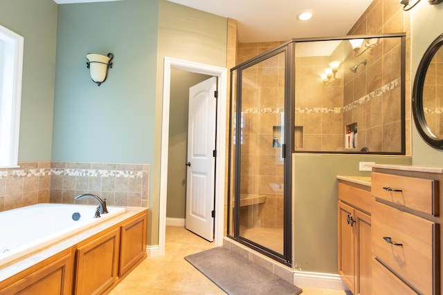 315 W Proctor St, Sturgeon, MO 65284 - bathroom featuring a stall shower, vanity, a bath, tile patterned floors, and recessed lighting