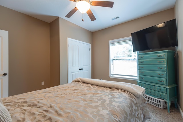 315 W Proctor St, Sturgeon, MO 65284 - carpeted bedroom featuring a ceiling fan and a closet