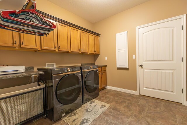 315 W Proctor St, Sturgeon, MO 65284 - washroom featuring cabinet space and washer and clothes dryer