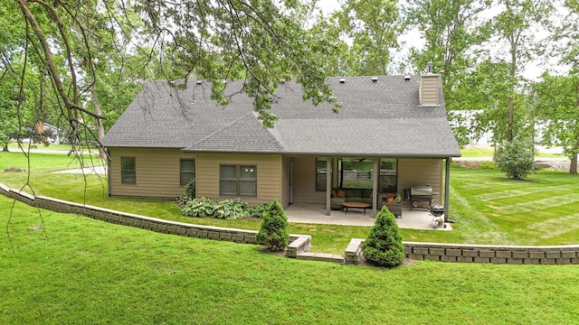 315 W Proctor St, Sturgeon, MO 65284 - back of property featuring a patio area, a yard, a ceiling fan, and roof with shingles