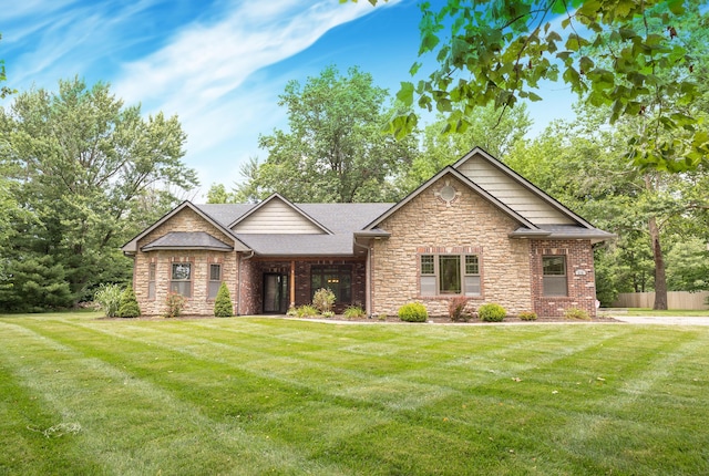 315 W Proctor St, Sturgeon, MO 65284 - view of front facade featuring stone siding, roof with shingles, and brick siding