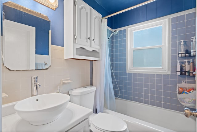 708 Clayton St, Columbia, MO 65203 - bathroom featuring tile walls, shower / bath combo with shower curtain, and vanity