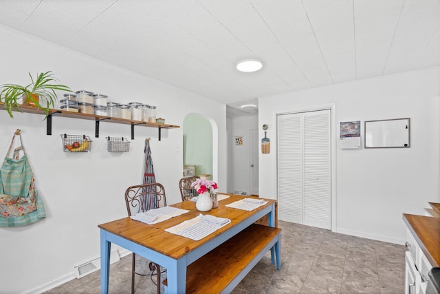 708 Clayton St, Columbia, MO 65203 - dining room featuring arched walkways and baseboards