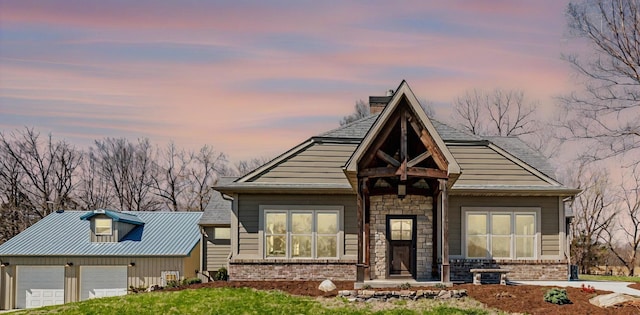 8900 W Graham Rd, Rocheport, MO 65279 - view of front of property with brick siding, a chimney, and an attached garage