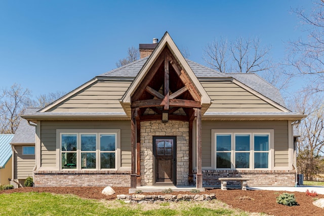 8900 W Graham Rd, Rocheport, MO 65279 - view of front of house with brick siding and a chimney